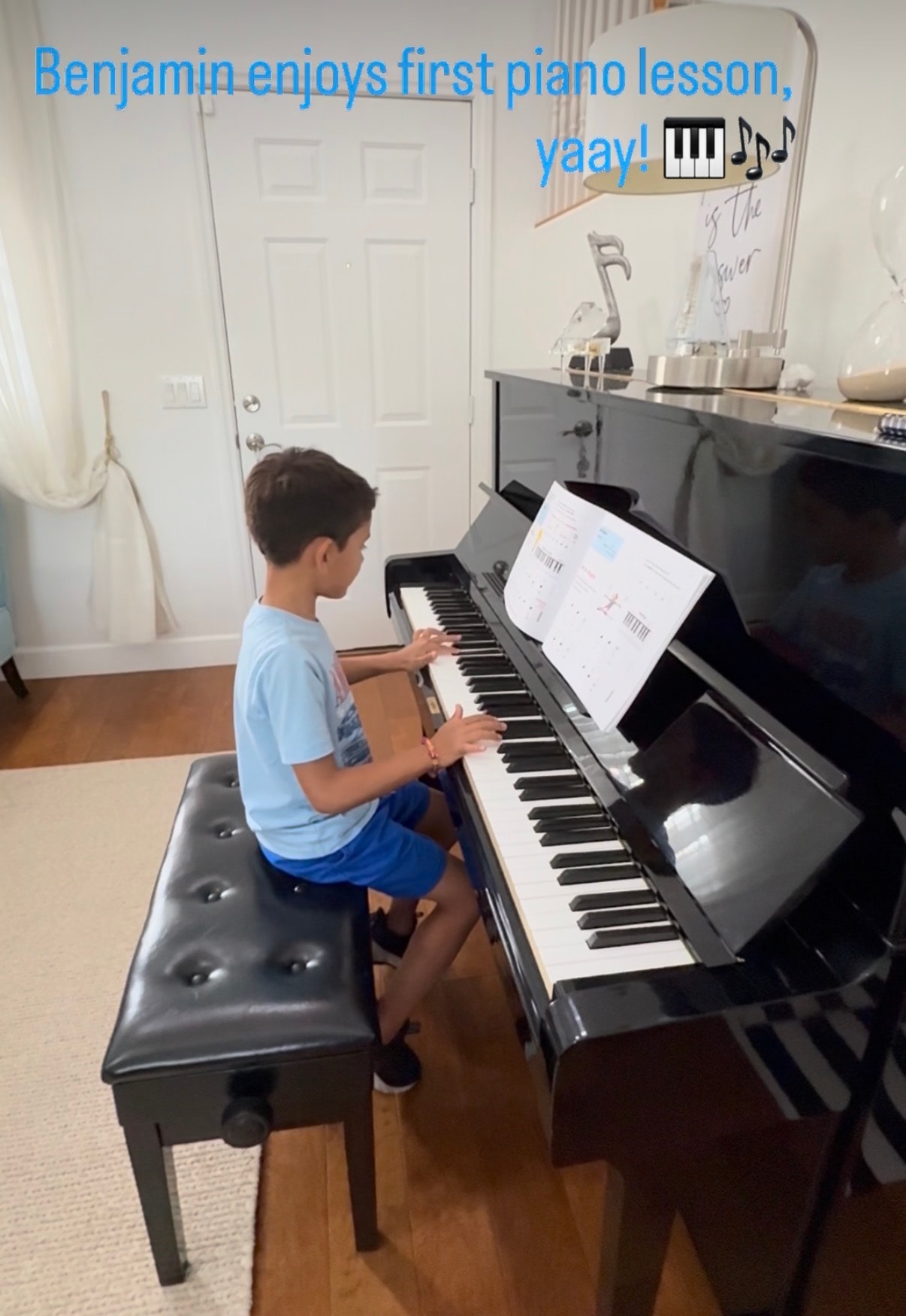 Benjamin enjoying his first piano lesson