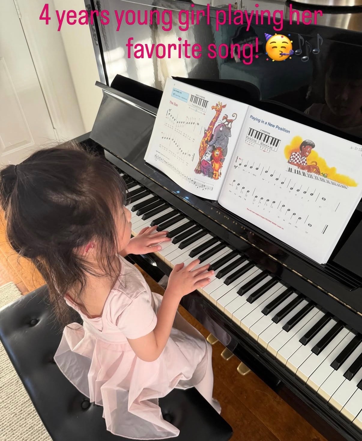 Four-year-old piano student playing her favorite song
